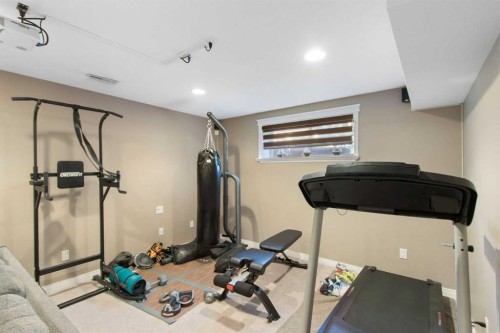 38 Spring Crescent Sw, Calgary, AB - Indoor Photo Showing Gym Room