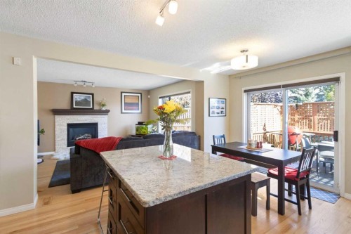 38 Spring Crescent Sw, Calgary, AB - Indoor With Fireplace