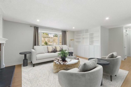 1452 Lake Sylvan Drive Se, Calgary, AB - Indoor Photo Showing Living Room With Fireplace