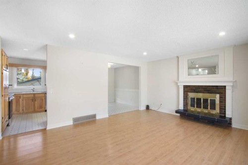 1452 Lake Sylvan Drive Se, Calgary, AB - Indoor Photo Showing Living Room With Fireplace