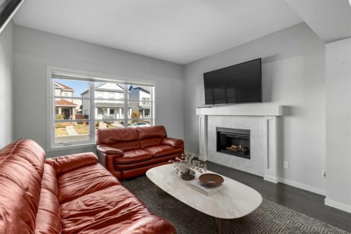 232 Copperpond Parade Se, Calgary, AB - Indoor Photo Showing Living Room With Fireplace