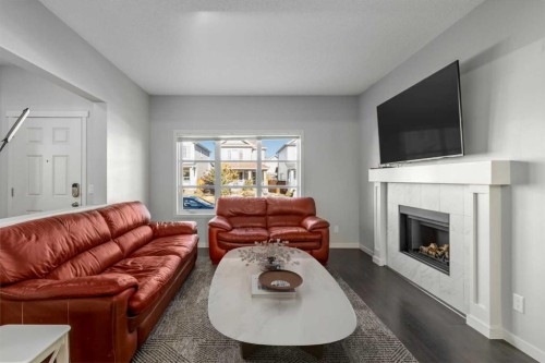 232 Copperpond Parade Se, Calgary, AB - Indoor Photo Showing Living Room With Fireplace
