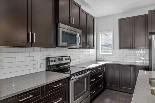 232 Copperpond Parade Se, Calgary, AB - Indoor Photo Showing Kitchen With Upgraded Kitchen