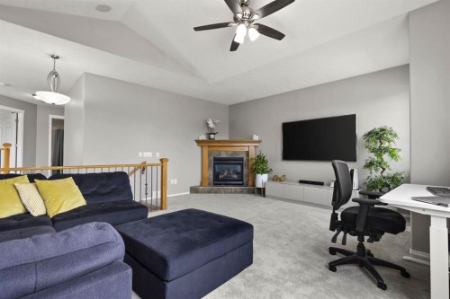 38 Simcoe Crescent Sw, Calgary, AB - Indoor Photo Showing Living Room With Fireplace