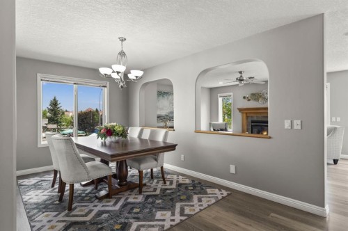 38 Simcoe Crescent Sw, Calgary, AB - Indoor Photo Showing Dining Room With Fireplace