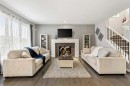 154 Masters Point Se, Calgary, AB  - Indoor Photo Showing Living Room With Fireplace 