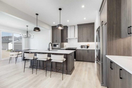 4058 Sawgrass Street Nw, Airdrie, AB - Indoor Photo Showing Kitchen With Upgraded Kitchen