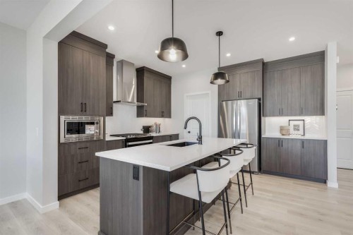 4058 Sawgrass Street Nw, Airdrie, AB - Indoor Photo Showing Kitchen With Upgraded Kitchen