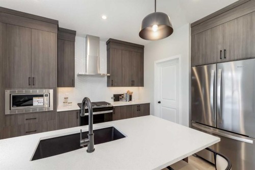 4058 Sawgrass Street Nw, Airdrie, AB - Indoor Photo Showing Kitchen With Upgraded Kitchen