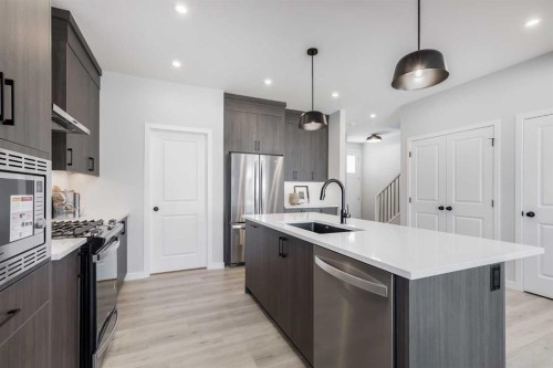 4058 Sawgrass Street Nw, Airdrie, AB - Indoor Photo Showing Kitchen With Upgraded Kitchen