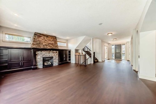 38 Aspen Meadows Park Sw, Calgary, AB - Indoor Photo Showing Other Room With Fireplace