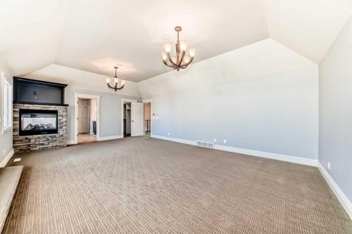 38 Aspen Meadows Park Sw, Calgary, AB - Indoor Photo Showing Other Room With Fireplace