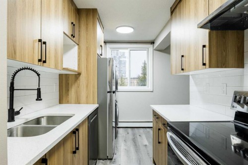 1121 37 Street Sw, Calgary, AB - Indoor Photo Showing Kitchen With Double Sink
