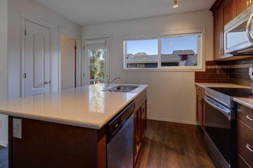 136 Evansborough Way Nw, Calgary, AB - Indoor Photo Showing Kitchen With Double Sink