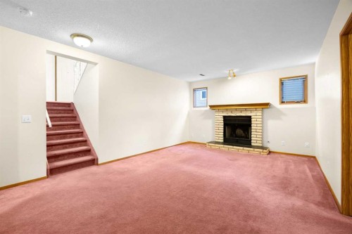 51 Macewan Park Rise Nw, Calgary, AB - Indoor Photo Showing Living Room With Fireplace