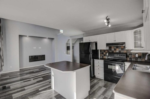61 Everstone Avenue Sw, Calgary, AB - Indoor Photo Showing Kitchen With Double Sink