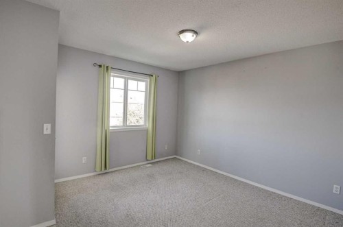 61 Everstone Avenue Sw, Calgary, AB - Indoor Photo Showing Other Room