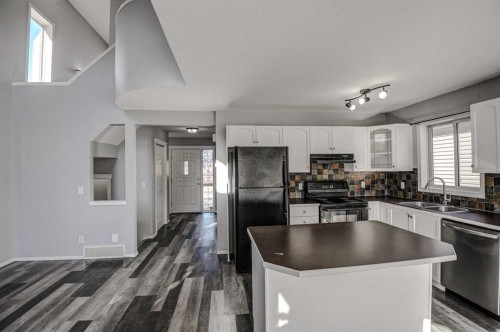 61 Everstone Avenue Sw, Calgary, AB - Indoor Photo Showing Kitchen With Double Sink