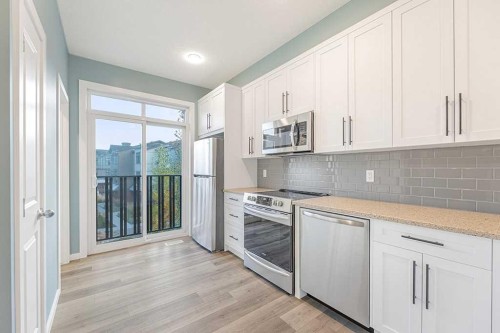 25 Spring Willow Close Sw, Calgary, AB - Indoor Photo Showing Kitchen