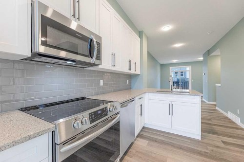 25 Spring Willow Close Sw, Calgary, AB - Indoor Photo Showing Kitchen With Stainless Steel Kitchen With Upgraded Kitchen