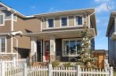 374 Sundown Road, Cochrane, AB  - Outdoor With Deck Patio Veranda With Facade 