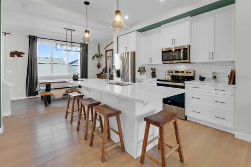 374 Sundown Road, Cochrane, AB - Indoor Photo Showing Kitchen With Upgraded Kitchen