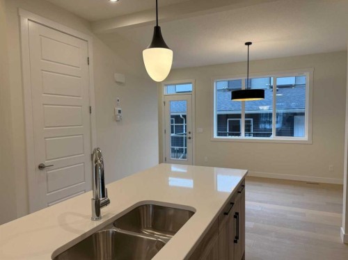 334 Sundown Road, Cochrane, AB - Indoor Photo Showing Kitchen With Double Sink