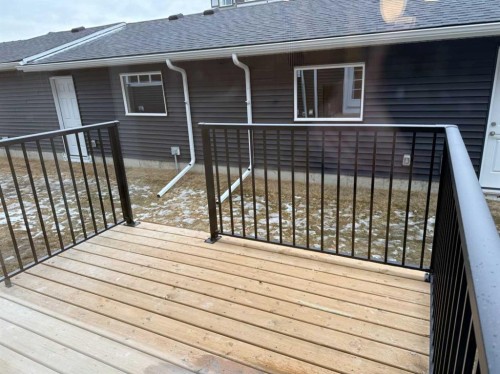 334 Sundown Road, Cochrane, AB - Outdoor With Deck Patio Veranda With Exterior