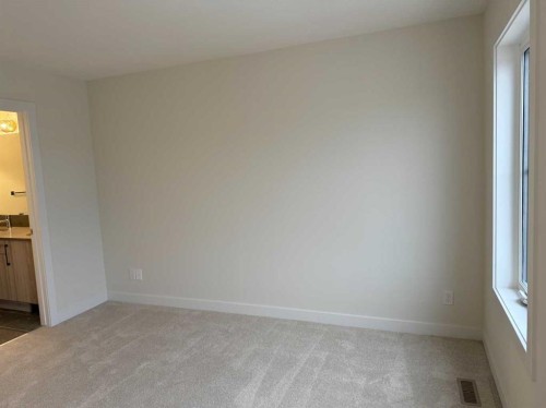 334 Sundown Road, Cochrane, AB - Indoor Photo Showing Other Room