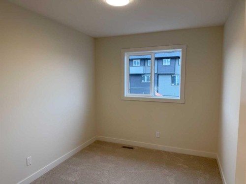 334 Sundown Road, Cochrane, AB - Indoor Photo Showing Other Room