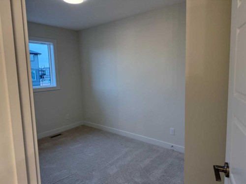 334 Sundown Road, Cochrane, AB - Indoor Photo Showing Other Room