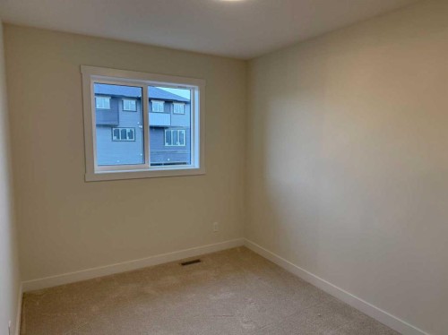 334 Sundown Road, Cochrane, AB - Indoor Photo Showing Other Room