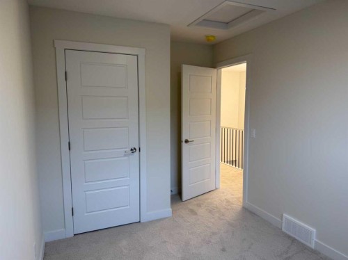 334 Sundown Road, Cochrane, AB - Indoor Photo Showing Other Room