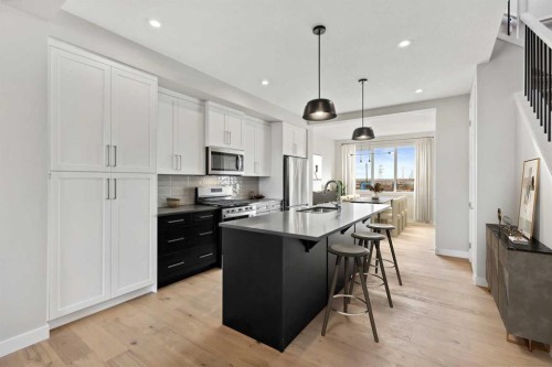 334 Sundown Road, Cochrane, AB - Indoor Photo Showing Kitchen With Upgraded Kitchen