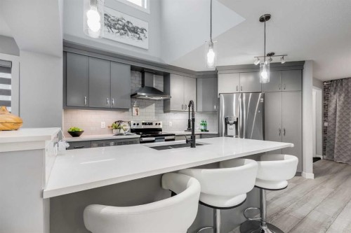 1037 Chinook Gate Heath Sw, Airdrie, AB - Indoor Photo Showing Kitchen With Stainless Steel Kitchen With Upgraded Kitchen