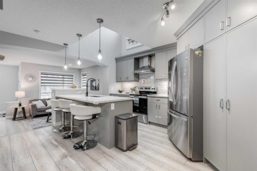 1037 Chinook Gate Heath Sw, Airdrie, AB - Indoor Photo Showing Kitchen With Stainless Steel Kitchen With Upgraded Kitchen