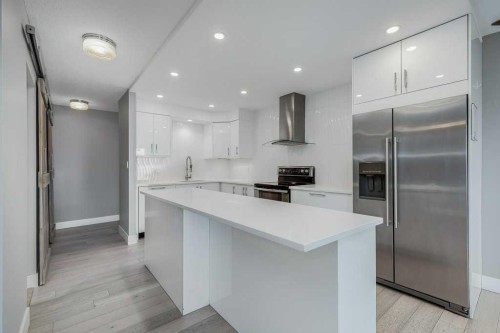404-1208 14 Avenue Sw, Calgary, AB - Indoor Photo Showing Kitchen With Stainless Steel Kitchen With Upgraded Kitchen
