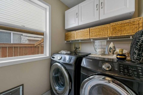 23 Valley Ponds Way Nw, Calgary, AB - Indoor Photo Showing Laundry Room