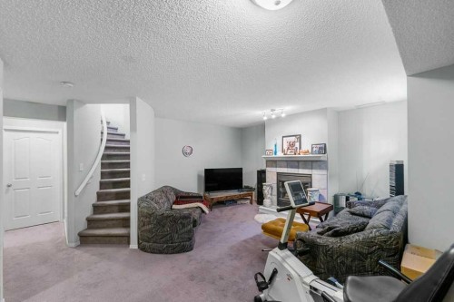 23 Valley Ponds Way Nw, Calgary, AB - Indoor Photo Showing Living Room With Fireplace