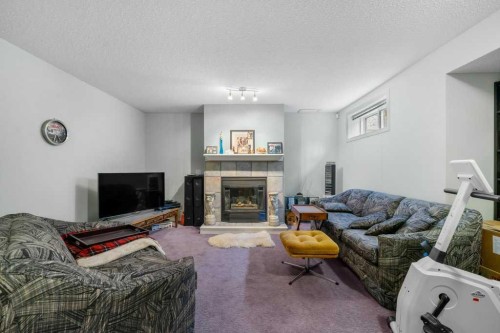 23 Valley Ponds Way Nw, Calgary, AB - Indoor Photo Showing Living Room With Fireplace