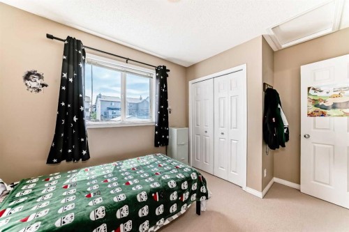423 Morningside Way Sw, Airdrie, AB - Indoor Photo Showing Bedroom