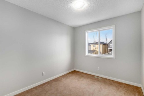 84 Fireside Way, Cochrane, AB - Indoor Photo Showing Other Room