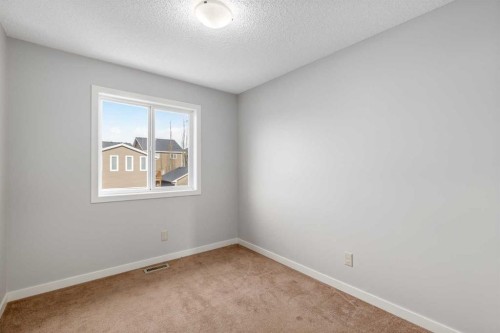 84 Fireside Way, Cochrane, AB - Indoor Photo Showing Other Room