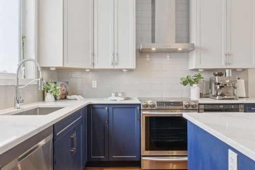 480 River Heights Green, Cochrane, AB - Indoor Photo Showing Kitchen With Upgraded Kitchen