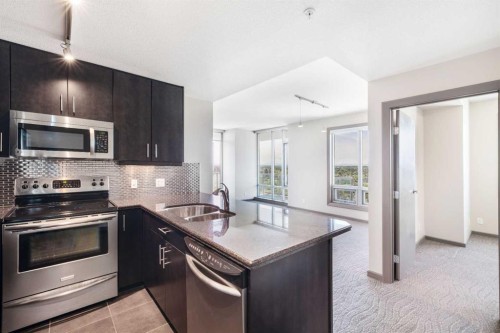 2010-210 15 Avenue Se, Calgary, AB - Indoor Photo Showing Kitchen With Stainless Steel Kitchen With Double Sink With Upgraded Kitchen