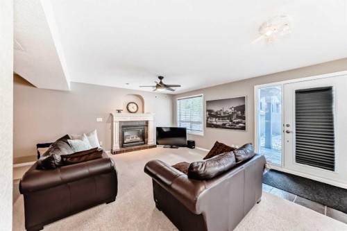238 Citadel Hills Circle Nw, Calgary, AB - Indoor Photo Showing Living Room With Fireplace
