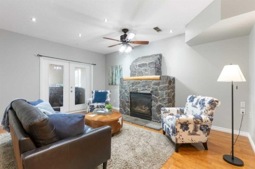 13003 Township Road 265, Rural Rocky View County, AB - Indoor Photo Showing Living Room With Fireplace