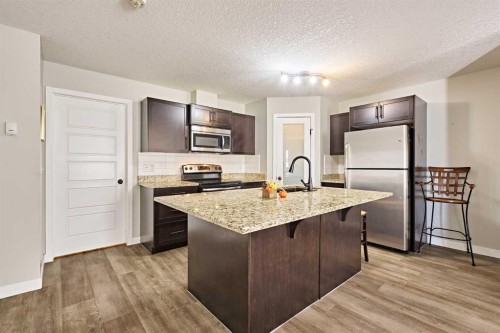 7101-2781 Chinook Winds Drive Sw, Airdrie, AB - Indoor Photo Showing Kitchen With Stainless Steel Kitchen With Upgraded Kitchen
