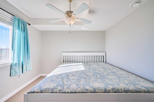 7101-2781 Chinook Winds Drive Sw, Airdrie, AB - Indoor Photo Showing Bedroom