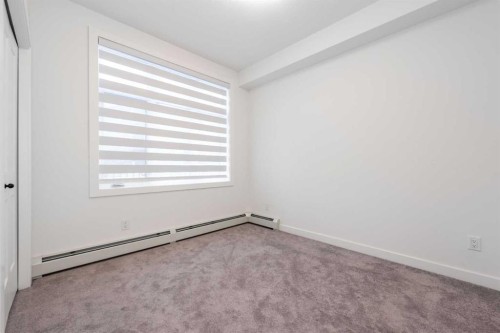 1105-200 Seton Circle Se, Calgary, AB - Indoor Photo Showing Other Room